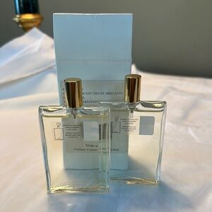 Elegant Cartier Perfume Bottles with Gold Caps
LHEURE BRILLANTE